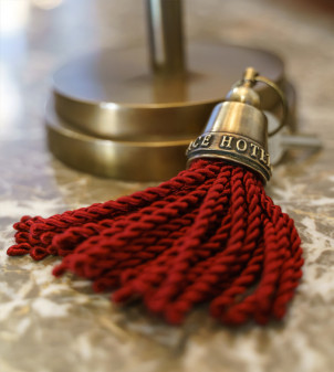 Brass keychain with fringe, with embossed logo